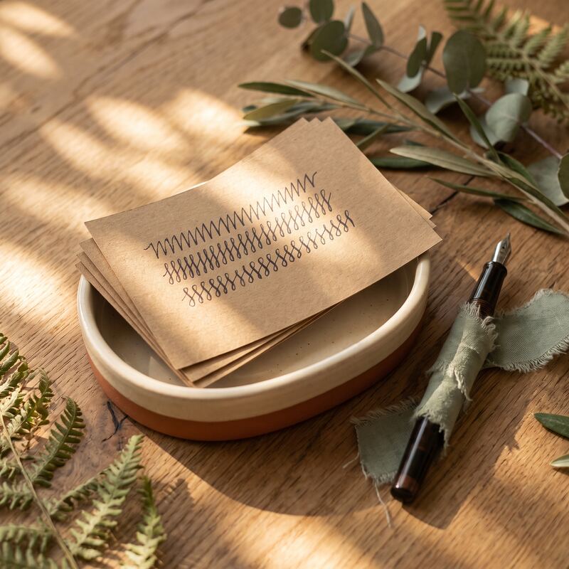 Recipe-style index cards on a timber desk symbolising reusable Claude Skills instructions for business automation
