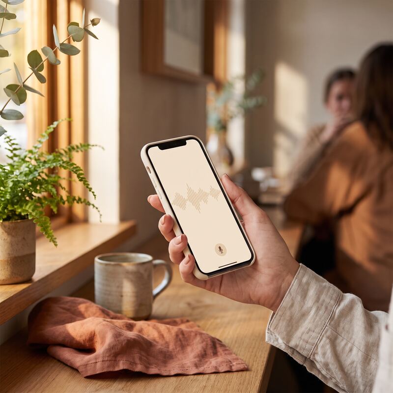 Entrepreneur dictating emails by phone with speech-to-text on the go instead of typing, saving hours of admin time Entrepreneur dictating emails by phone with speech-to-text on the go instead of typing, saving hours of admin time